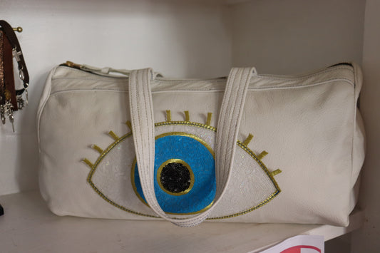 White leather evil eye bag